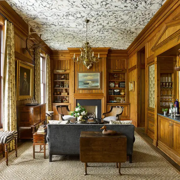 The family’s living room, clad in mahogany paneling, is Decker and Roddick’s favorite space in the whole home.